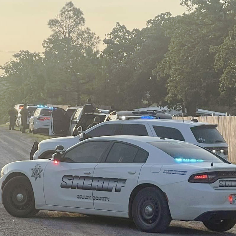 sheriff deputies patrolling a county road